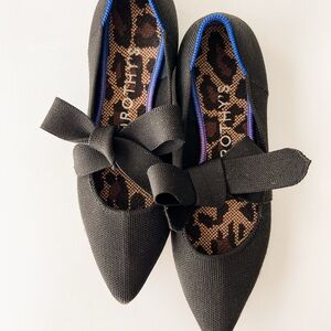 Rothy's Black Flats with Bow Detail and Sleek Design